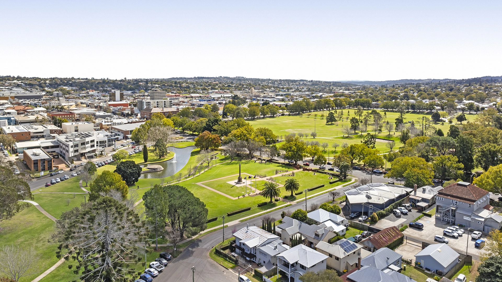 Aerial view across Queens Park toward Toowoomba CBD with the Bannockburn properties below